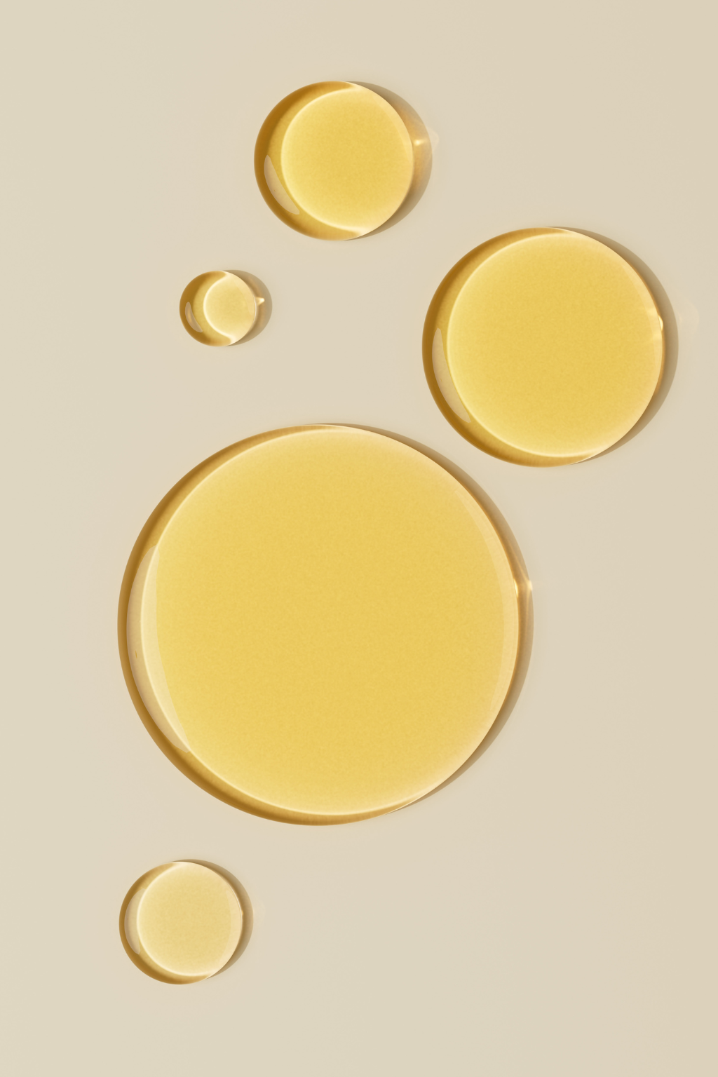 Golden oil  on a beige background